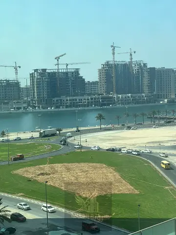 For Annual Rent in Al Khan, Sharjah. Spacious one-bedroom apartment with hall in a prime location, featuring a sea view, central air conditioning and