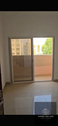 1-bedroom apartment for annual rent in Ajman Corniche, 2 bathrooms, balcony, central AC, opposite Al Safina Roundabout, behind Maya Supermarket. AED 2