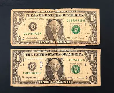 Two Circulated US One Dollar Bills (Series Notes) — Used Condition