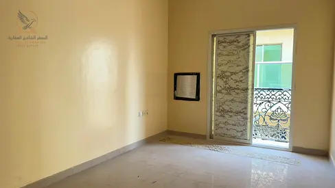 Two rooms and a living area with a balcony, located in Industrial Area 2 behind Emirates Markets.