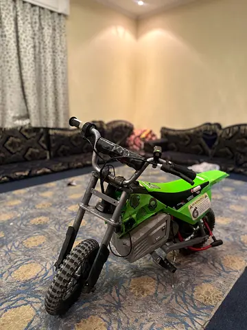 Green Razor Sx350 with front light and many stickers
