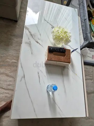 White marble-look coffee table with storage in good condition