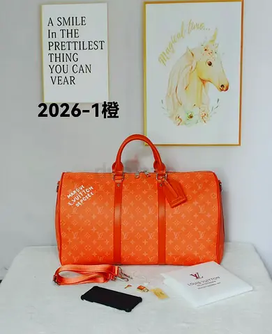 Orange monogram travel duffel bag with shoulder strap - master copy