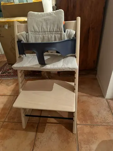 Stokke Tripp Trapp high chair with baby safety and cushion seat.