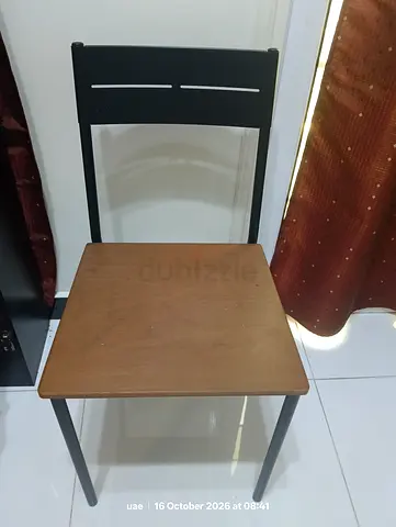 Simple wooden seat with black metal frame - good condition