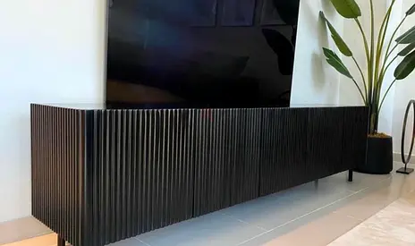 Long black slatted tv cabinet