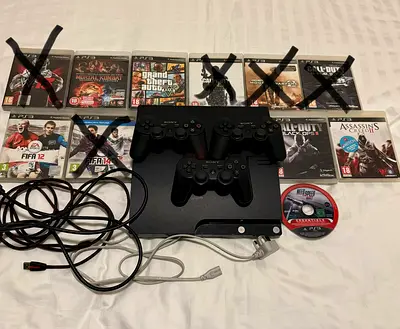 Sony PS3 Original Slim Console With 6 Games and 3 Controllers