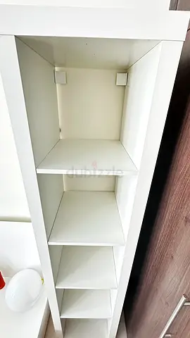 Tall white shelving unit with multiple cubby shelves - good condition