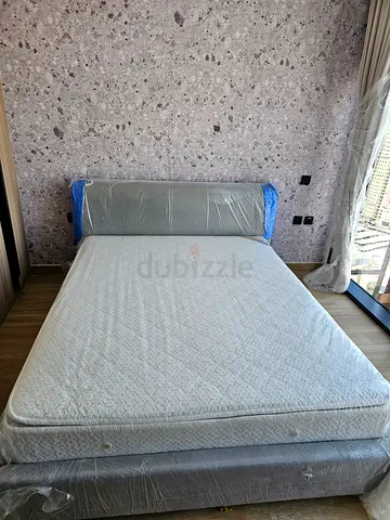 Premium quality Queen bed with mattress -  new, still wrapped and never used.