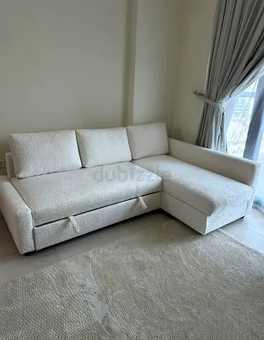IKEA Corner Sofa Bed with Hidden Storage
Stylish IKEA corner sofa bed featuring a clean white fini