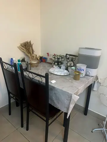 4-Seater Dining Table with 4 Chairs — Frame, wooden-Top Look. Four additional chairs.