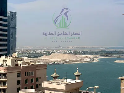 2-bedroom apartment in Al Mamzar with a master bedroom, 2 bathrooms, balcony, free AC, and flexible payment in 4 or 6 instalments.