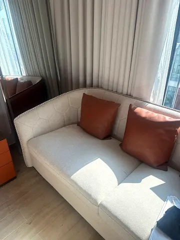 Light grey single-seater chaise sofa with brown cushions - good condition
