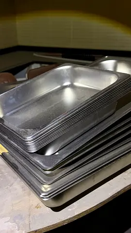 Set of used catering baking / serving trays - aluminium stack