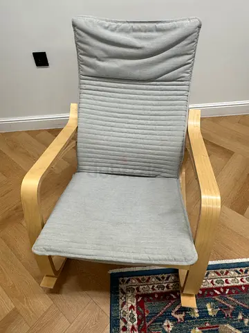 Light wood frame lounge chair with grey cushion