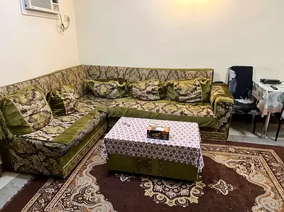 L-shaped vintage green patterned sofa set - good condition