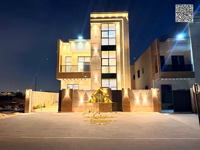 Brand-new luxury classic-style villa for sale in Al Helio 2, Ajman. Featuring elegant, high-end finishes, the villa includes 6 master bedrooms. This i