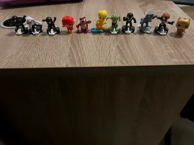 Collection of small collectible character figurines (11 pieces)