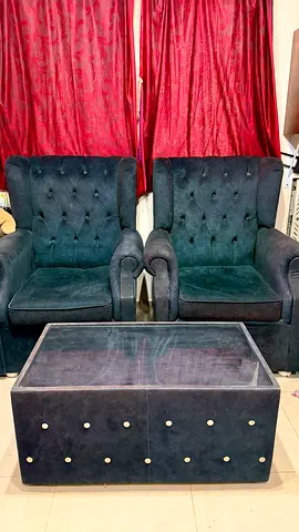 Pair of dark green tufted armchairs with matching ottoman/coffee box