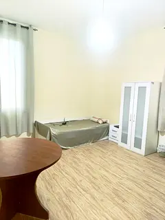 A neat and clean bedroom is available for a Keralite working lady in a family flat.