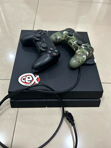 PlayStation 4 Fat version with 2 Controllers (Black + Camo) - Good Working Condition with free games
