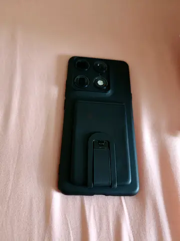 Motorola Signature black smartphone with protective case and kickstand (used)