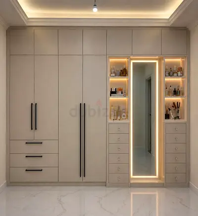 Built-in wardrobe with mirrored vanity and LED-lit shelving
