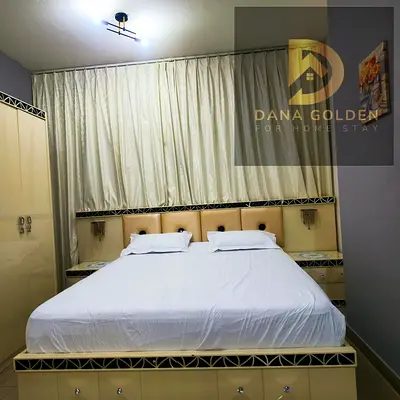 Two-bedroom apartment with a living r’s room for rent in Al-Taawun.oom and a maid