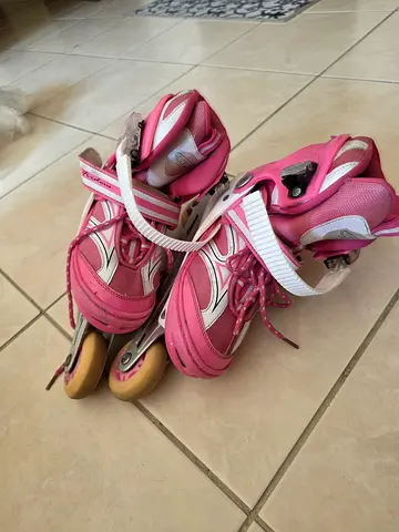 Pink adjustable inline roller skates - kids size, lightly used