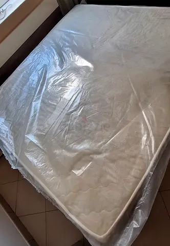 King-size mattress in good condition (covered in protective wrap)