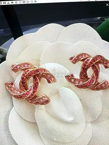 Pair of Chanel pink crystal interlocking logo stud earrings