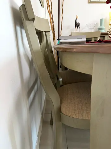 Solid wood dining table with 6 upholstered chairs and buffet showcase.