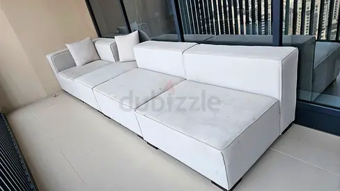 White modular 4-seater sofa (removable sections) - good condition. Cleaning needed
