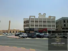 Residential and commercial building on a corner of two streets, 11 years old, with an annual income
