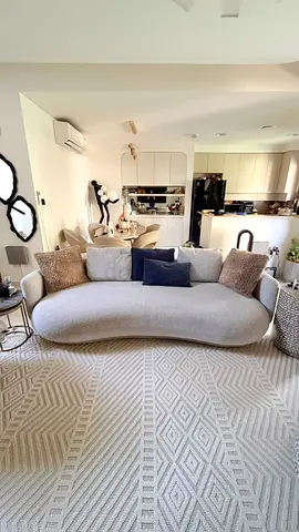 Curved Modern Sofa in Light Grey with Cushions - Good Condition