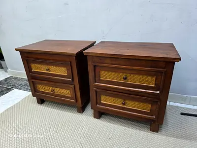 Pair of solid wood bedside tables with woven rattan drawer fronts