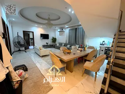 Villa for sale in Al Yasmeen, Ajman. Includes electricity, air conditioning, and furniture. Features 5 master bedrooms, a majlis, a living area, and a