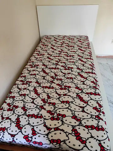 Single bed base with Hello Kitty mattress cover - good condition