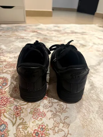 Nike Air Force 1s in black