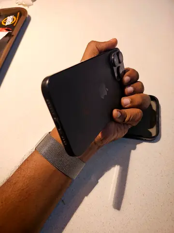 Used iPhone 15Pro Max Good Battery Health - Black Titanium with case, good condition 2400AED