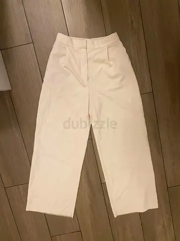 white-cream colored pants