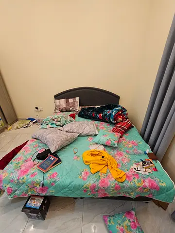 Queen size bed frame with mattress and floral bedding - used