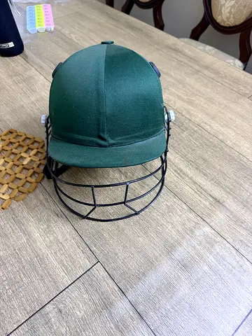 Green Cricket Helmet with Face Guard - Good Condition