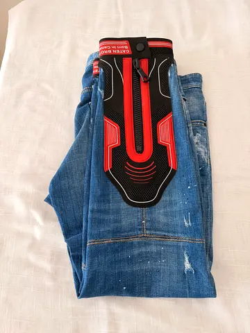 Men's blue distressed jeans - good condition, size tag visible