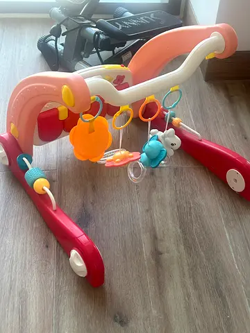 Baby activity walker with toy bar - gently used