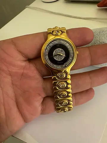 Gold-tone women's wristwatch with crystal accents — good condition