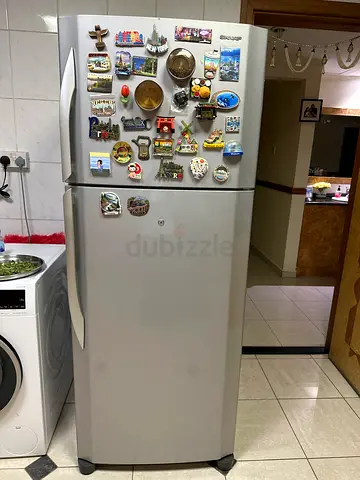 Silver double-door refrigerator in good working condition