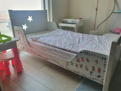 White toddler/child/kid bed (140cm * 70 cm), mattress with cover, and a colorful blanket