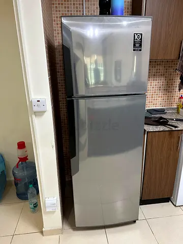 Silver double-door refrigerator - good working condition
