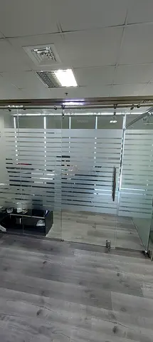 Glass partition with curtain
